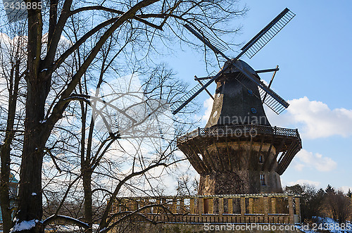 Image of Winter landscape with traditional old windmill