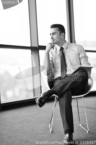 Image of happy young business man at office