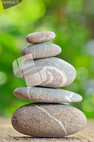 Image of Stack of Stones on a wooden table