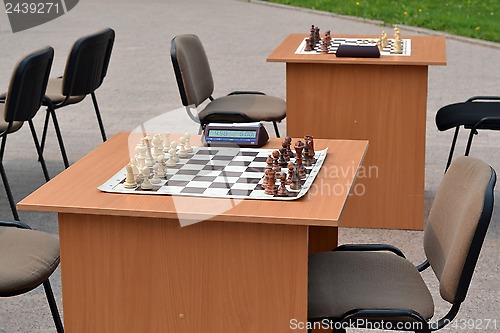 Image of street tournament on chess on a holiday day of the athlete. Tyum