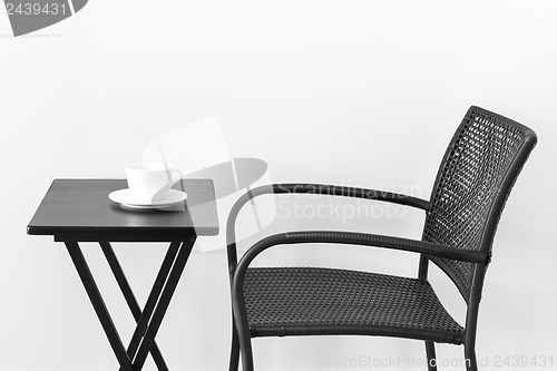 Image of Chair, table and teacup