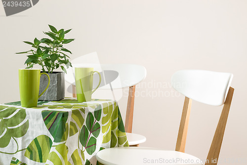 Image of Bright green table with teacups