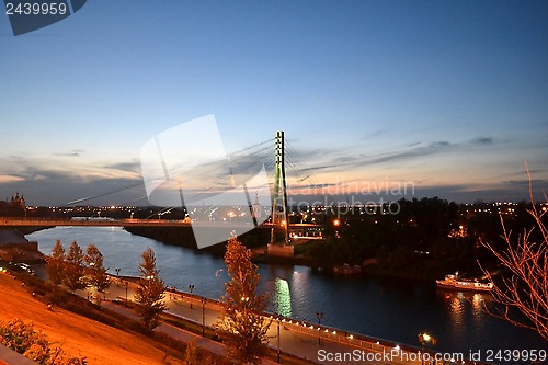 Image of The bridge for pedestrians through the Tura River, Tyumen, in ni