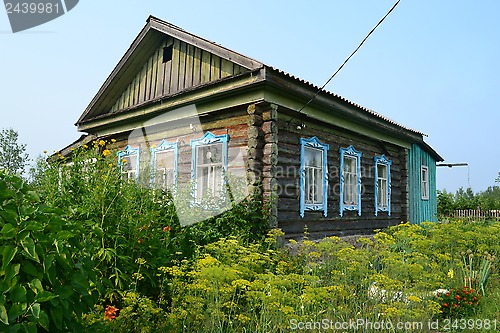 Image of The wooden house in the village in the summer.