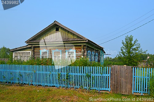 Image of The wooden house in the village in the summer.