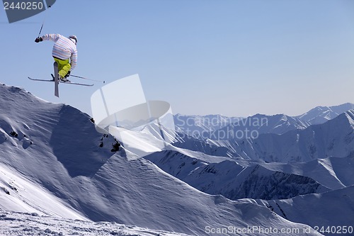 Image of Freestyle ski jumper with crossed skis