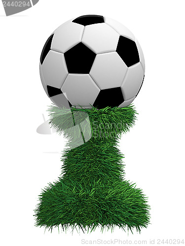 Image of Soccer ball trophy on green grass pedestal
