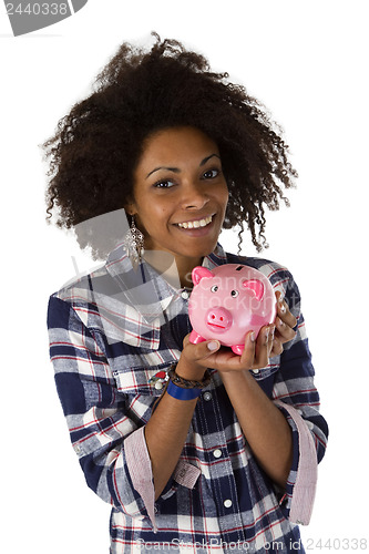 Image of Young african american woman with piggy bank