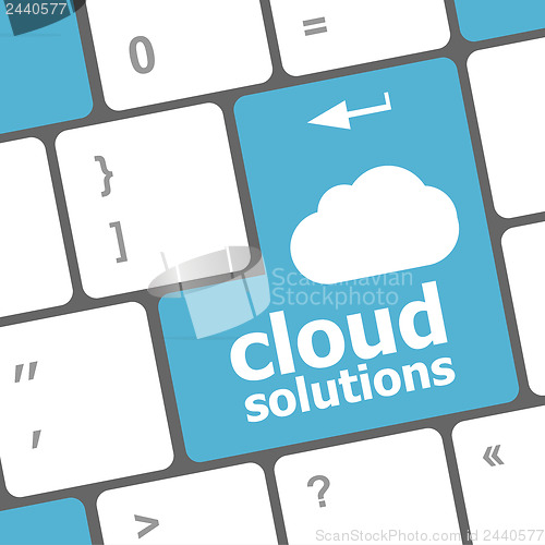 Image of cloud solution words concept on blue button of the keyboard