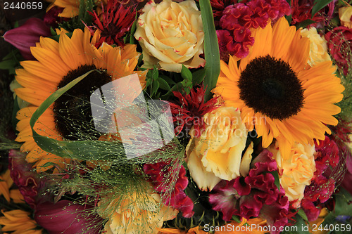 Image of Yellow and red flower arrangement