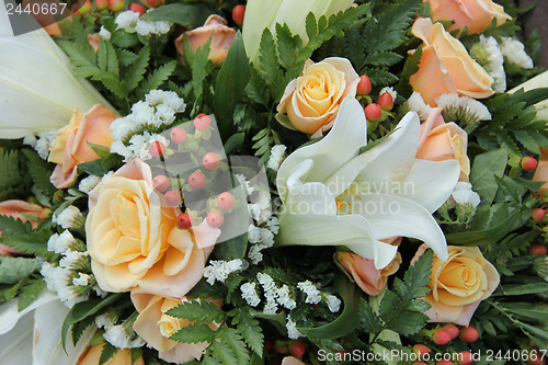 Image of Roses and lillies in a bridal arrangement