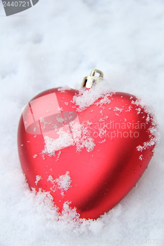 Image of Heart shaped ornament in the snow