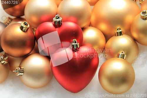 Image of red heart shaped christmas ornaments