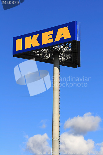 Image of IKEA  Sign against Blue Sky with Some Clouds