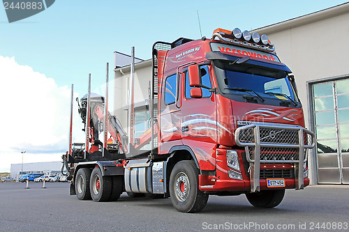 Image of Red Volvo Logging Truck