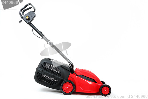 Image of new red lawnmower on white background