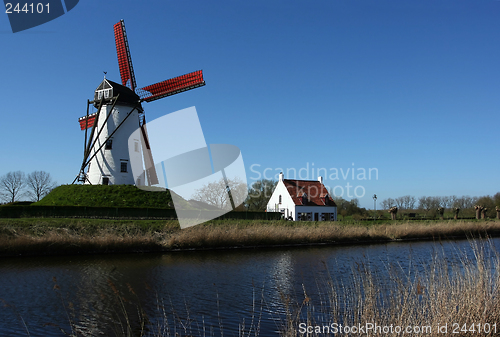 Image of windmill near canal