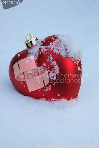 Image of Heart shaped ornament in the snow