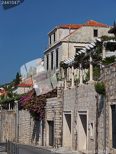 Image of White stone and orange tiles mediterranean building on an hillsi