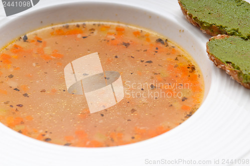Image of Italian minestrone soup with pesto crostini on side