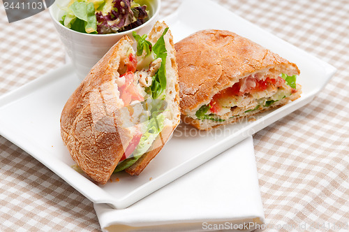 Image of ciabatta panini sandwich with chicken and tomato