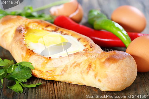 Image of Pie with cheese and egg. Georgian cuisine.