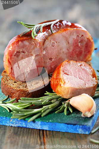 Image of Home sausage on rye bread.