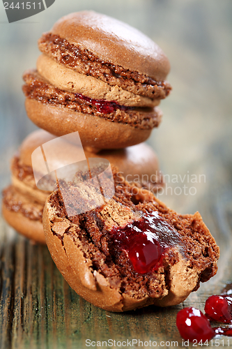 Image of Almond cake with chocolate filling and berries.