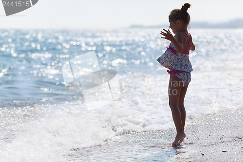 Image of Little five year old girl at the beach