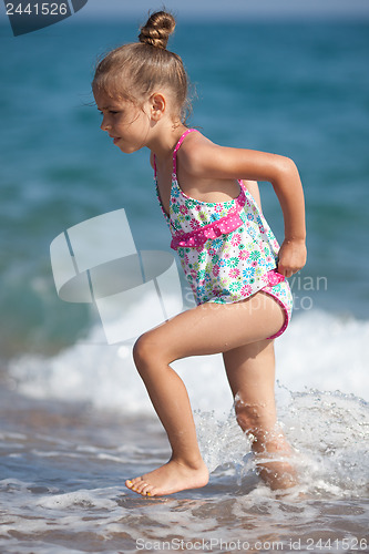 Image of Little five year old girl at the beach