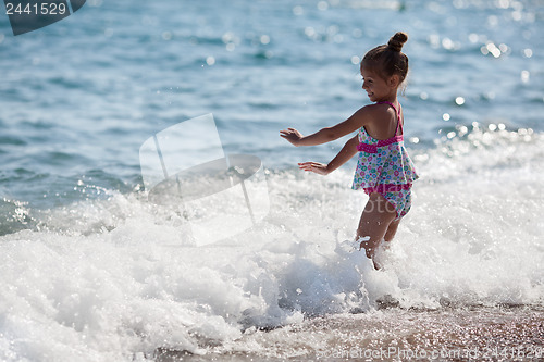 Image of Happy little girl and sea