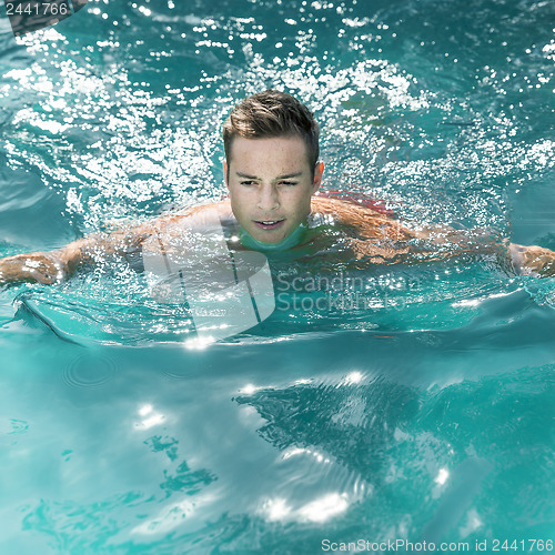 Image of young man swimming