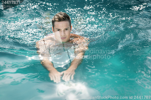 Image of young man swimming