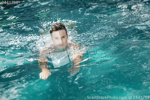 Image of young man swimming