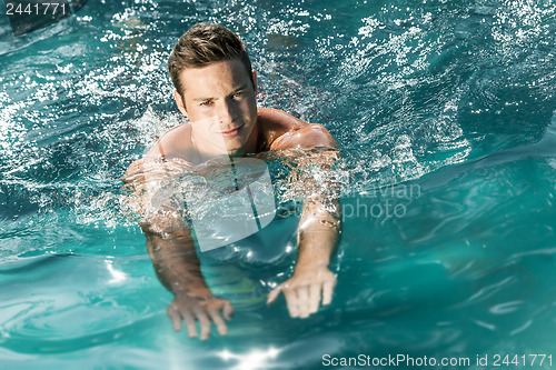 Image of young man swimming