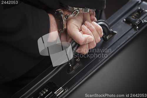 Image of Woman In Handcuffs Carrying Briefcase