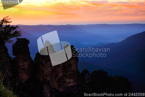 Image of Dawn sunrise silhouettes the Three Sisters Blue Mountains Austra