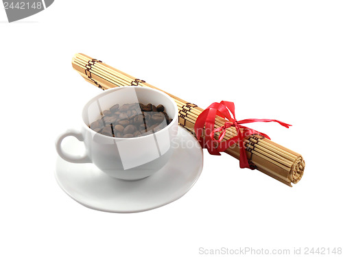 Image of coffee cup with coffee beans and bamboo isolated on white