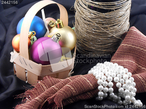 Image of bottle of champagne, christmas decorations and white diamonds