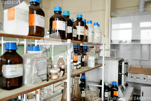 Image of old laboratory with a lot of bottles