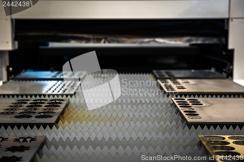 Image of Laser cutter cutting metal plates