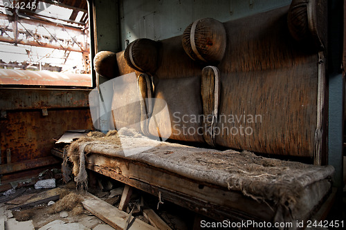 Image of Damaged retro seats in a cabin