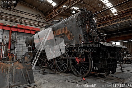 Image of Old industrial locomotive in the garage