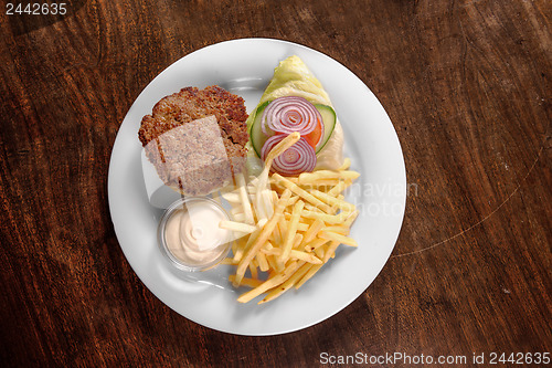 Image of Delicious hamburger on white plate