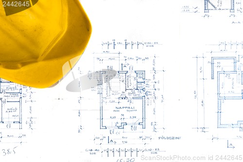 Image of Helmet of an engineer with plans