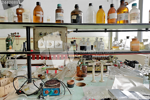 Image of old laboratory with a lot of bottles