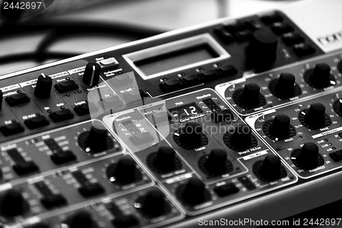 Image of Closeup photo of an audio mixer
