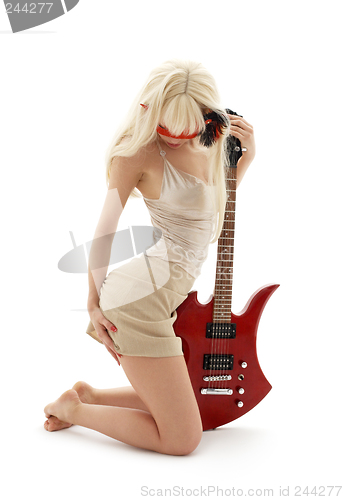Image of girl in mask with red guitar