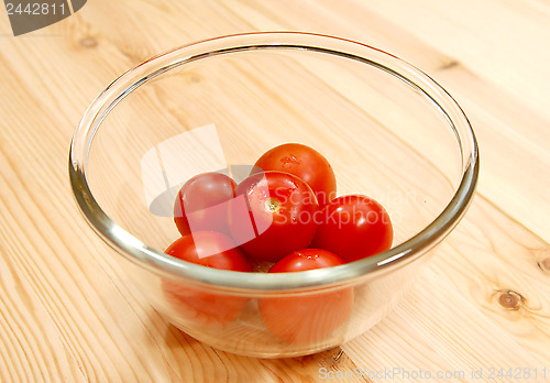 Image of Fresh red tomatoes in a glass bowl