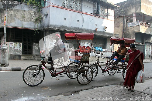 Image of Rickshaw man waits for the customers on the streets of Kolkata